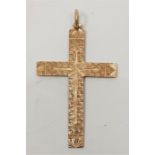 A 14ct. gold cross, with engraved and engine turned decoration to both sides, height 6.5cm. (6.7g)