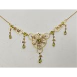 A precious yellow metal peridot and seed pearl necklace, in the belle epoque style, the open work