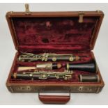 A c.1940's (or earlier) C.G. Conn clarinet, together with a Selmer Goldentone mouth piece, in case.