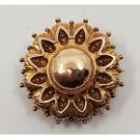 A 14ct. gold circular brooch, diameter 34mm. (3.7g)