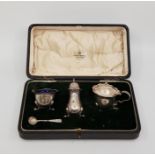 A three piece silver cruet set, by Mappin & Webb Ltd, assayed Birmingham 1924, with an associated