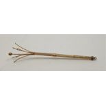 A 9ct. gold engine turned swizzle stick, of traditional form, assayed Birmingham 1979, length when