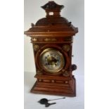 A large Early 20th cent oak cased mantle clock