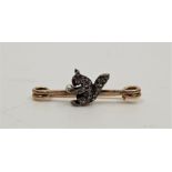 An antique precious metal and diamond set 'squirrel' bar brooch, having realistically fashioned