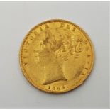 An 1864 Victoria "Young head" gold sovereign, rev. shield, die no:33.