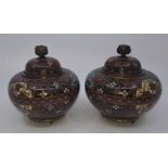 A pair of Meiji period Japanese cloisonne Koro, of fine quality, decorated with floral patterns,