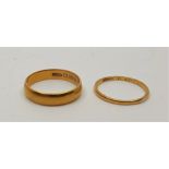 Two 22ct. gold bands, (total 7.1g). (2)  Ring sizes: UK R !/2 & UK N 1/2+