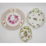 A collection of seven Herend hand painted porcelain items, to include: two leaf form dishes, a