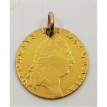 A 1793 George III gold spade guinea, pierced as a pendant or charm.