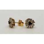 A pair of precious yellow metal, sapphire and diamond cluster stud earrings, set round cut