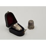 An Edwardian silver thimble, by James Fenton, Birmingham 1901, with thistle motif to side, in