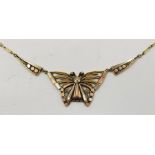 A tri-colour precious metal "butterfly" pendant necklace, (metal assessed as 9ct. gold), length 42.