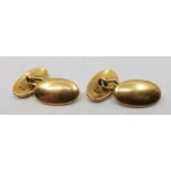 A pair of 18ct. gold oval cuff links, chain fitting. (16.2g)