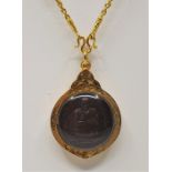 A Thai Buddhist pendant, having engraved precious yellow metal mount, width 33mm, suspended from