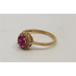A 9ct. gold and synthetic pink stone ring, claw set round cut synthetic pink stone to centre