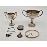 Two silver twin handled trophy cups, both engraved winner N.S.R.C. tennis, mens singles and