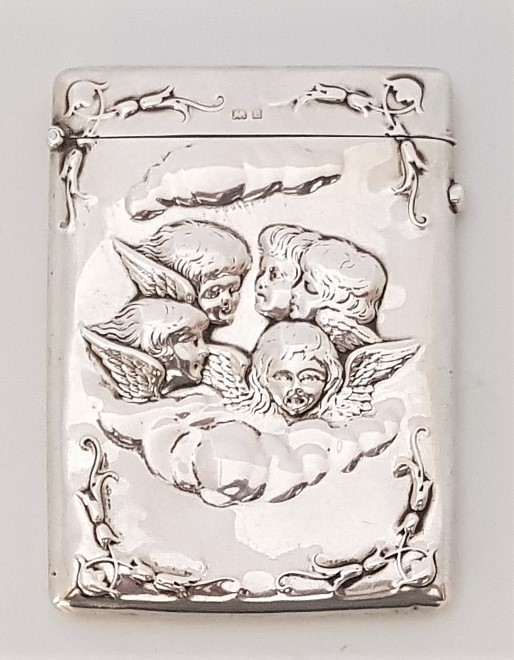 A silver card case, by Horton & Allday, assayed Birmingham 1902, the front repousse cherubs within a