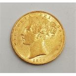 An 1868 Victoria "Young head" gold sovereign, rev. shield, die no.19.