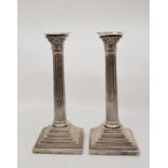 A pair of Edwardian silver Corinthian column candlesticks, by Charles Boyton III, assayed London