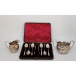 An Edwardian silver coffee spoon and sugar tong set, by Richard Martin & Ebenezer Hall, assayed