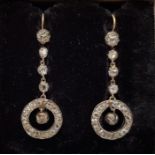 A pair of early 19th century white metal and diamond set drop earrings, each having single old cut