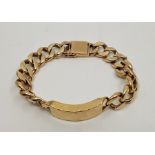 A heavy 9ct. gold gentleman's flat curb link identity bracelet, with fold over clasp. length