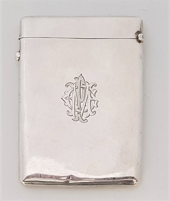 A silver card case, by Horton & Allday, assayed Birmingham 1902, the front repousse cherubs within a - Image 2 of 2