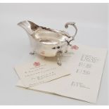 A silver sauce boat, by Harrison Brothers & Howson, assayed Sheffield 1930, with flying scroll