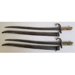 Two French 1866 pattern sword bayonets, having 57.5cm blades with back edge engraved details and