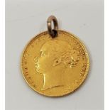 An 1871 Victoria gold sovereign, pierced as a pendant or charm.
