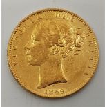 An 1869 Victoria "Young head" gold sovereign, rev. shield, die no.47.