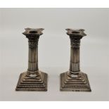 A pair of Victorian silver Corinthian column candlesticks, by William Hutton & sons Ltd, assayed