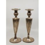 A pair of American silver candlesticks, by J E Caldwell & Co. (Philadelphia), each having