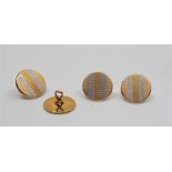 A set of four Edwardian 18ct. yellow gold and platinum engine turned dress shirt buttons, each