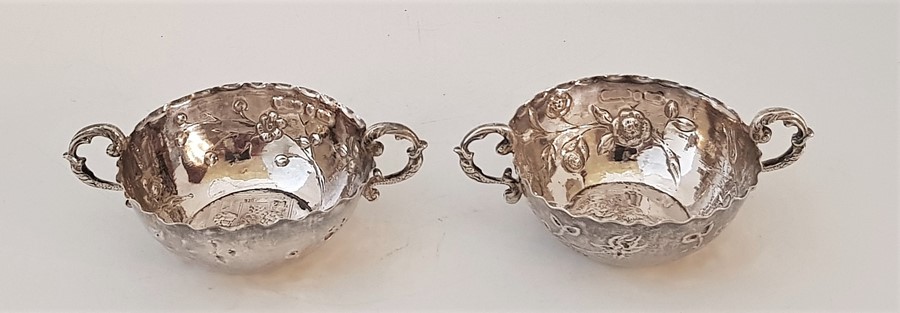 A pair of ornate Hanau silver small twin handled bowls, Hanau psuedo marks for Simon Rosenau (Bad