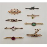 Seven various Edwardian and other precious yellow metal bar brooches, including a 9ct. gold,