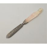 A late 19th century continental carved ivory and steel bladed paperknife, the ivory handle carved