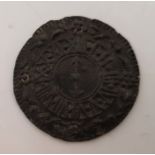 A pewter toy watch face, c.1670, found in the River Thames.