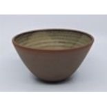A studio pottery bowl, with olive green glazed interior, diameter 15cm.