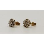 A pair of precious yellow metal and diamond cluster stud earrings, set seven round brilliant cut
