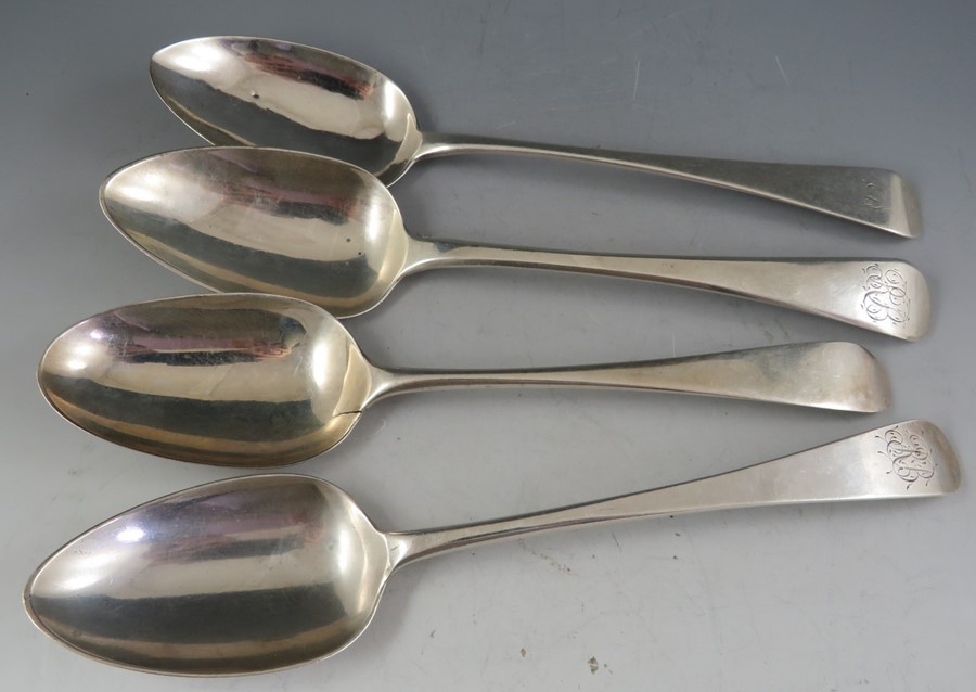 A small collection of four "Old English" silver table spoons including London 1812 by Peter &