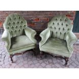 A pair of Queen Anne style scroll armchairs with serpentine cresting rails and deep button stuff