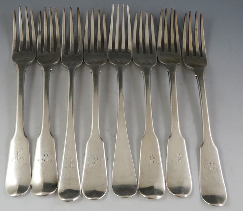 A mostly 19th century composite set of eight silver table forks of mixed design, dates and makers