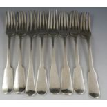 A mostly 19th century composite set of eight silver table forks of mixed design, dates and makers