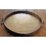 An Edwardian mahogany oval gallery tea tray with a pair of gilt brass handles. 59cm wide Provenance: