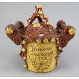 An early twentieth century two-handled lidded pot named and dated; William Duckworth 1902. It is