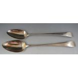 A pair of Geo III "Old English" pattern silver basting spoons. London 1803 makers marks obscured