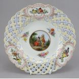 A late nineteenth century Meissen porcelain hand-painted plate with open-work rim, c. 1870. The