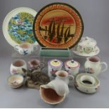 A group of largely 1960s Poole Pottery wares. To include: three jugs, two preserve pots, two plates,
