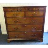 An early 19th century North country mahogany chest of drawers with three frieze over two short and